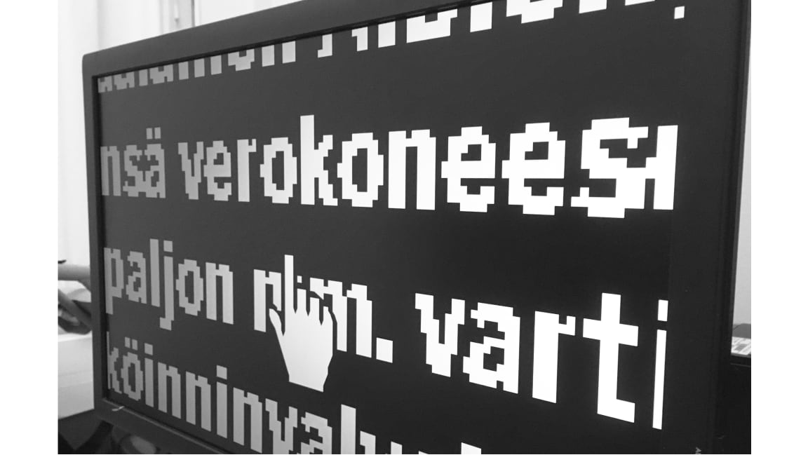 Computer screen showing a heavily magnified text and cursor.